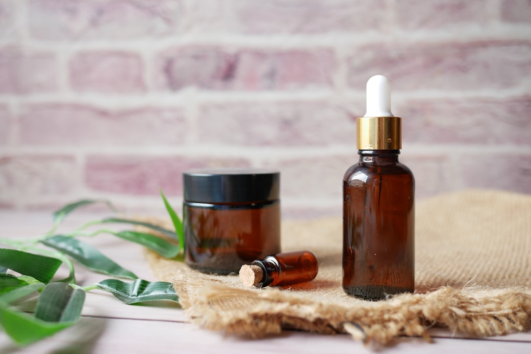 about-us-img eucalyptus essential oils in a glass bottle with green leaf on white background